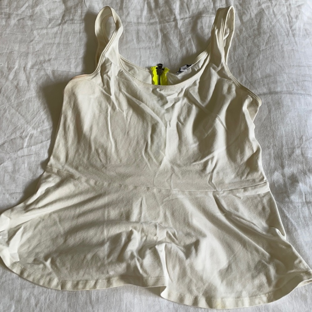 Express cream colored peplum top